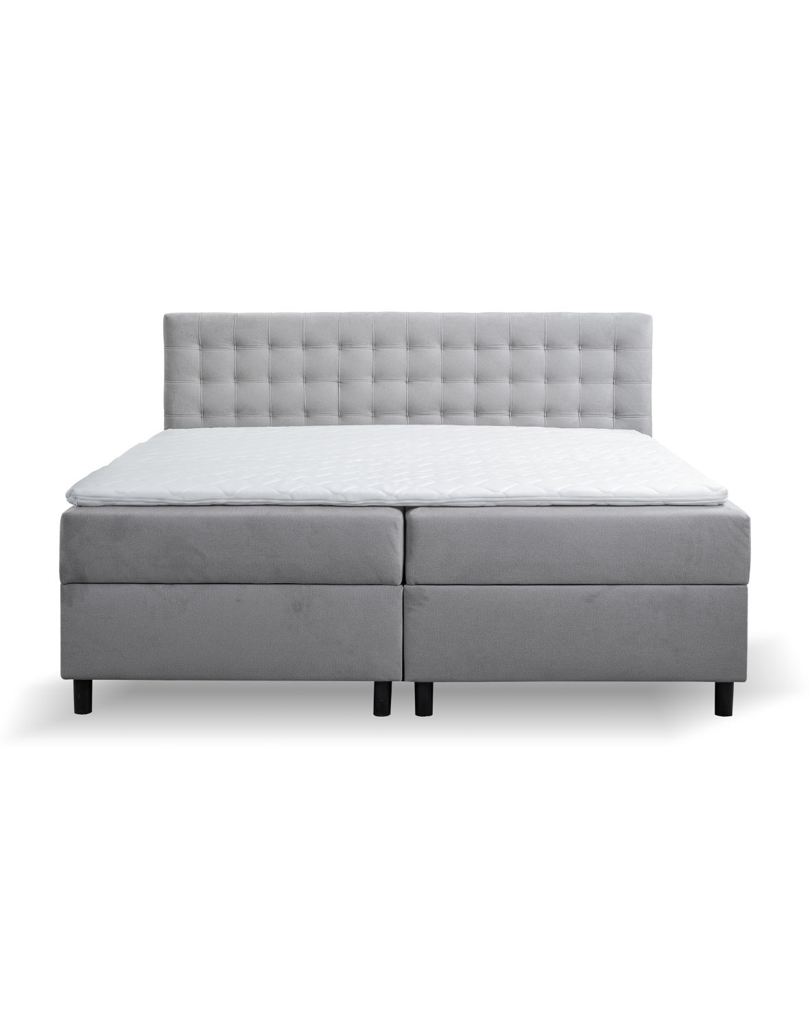 tapicerowane łóżko kontynentalne na nóżkach pilar